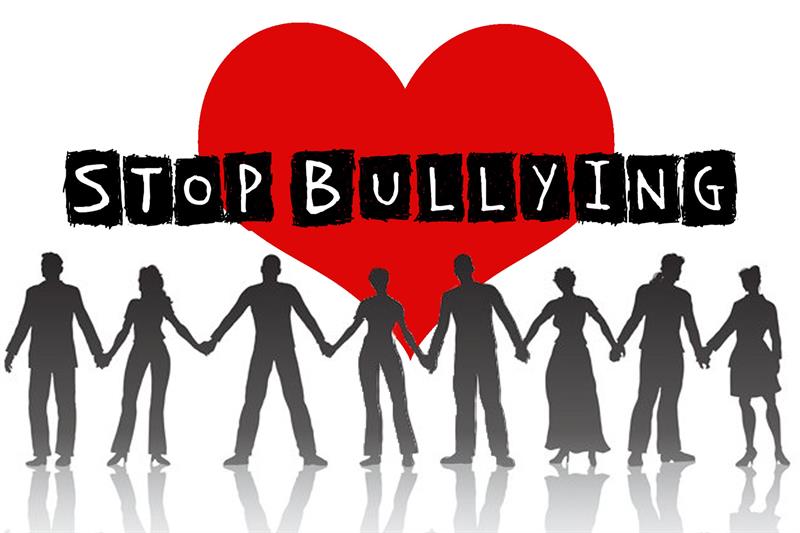 Stop Bullying Silhouette of people holding hands in front of a heart symbol - text says "stop bullying"